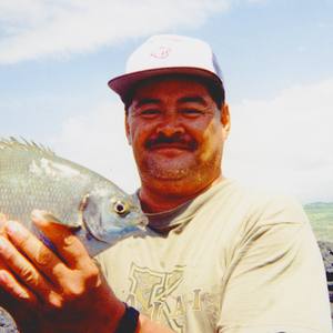 Melvin K. Yokoyama Sr. fishing on the Kaʻū coast